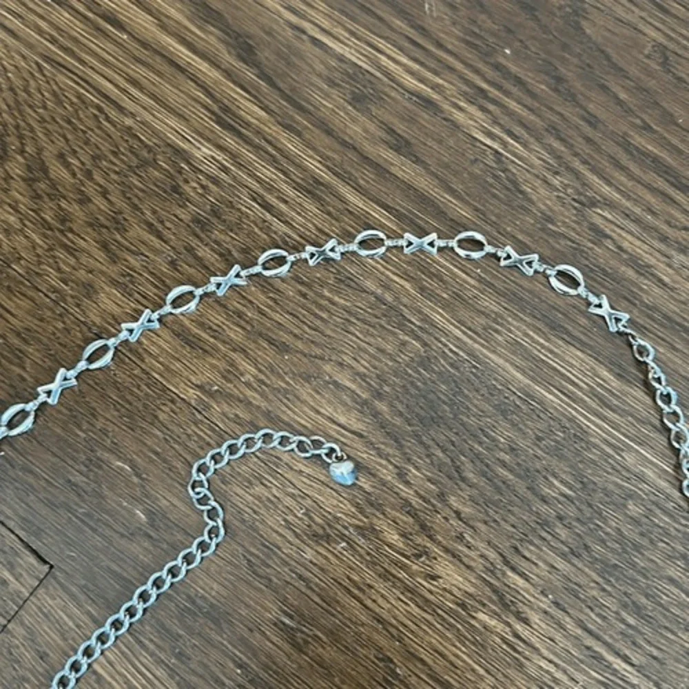 Gold tone XOXO thin metal chain belt